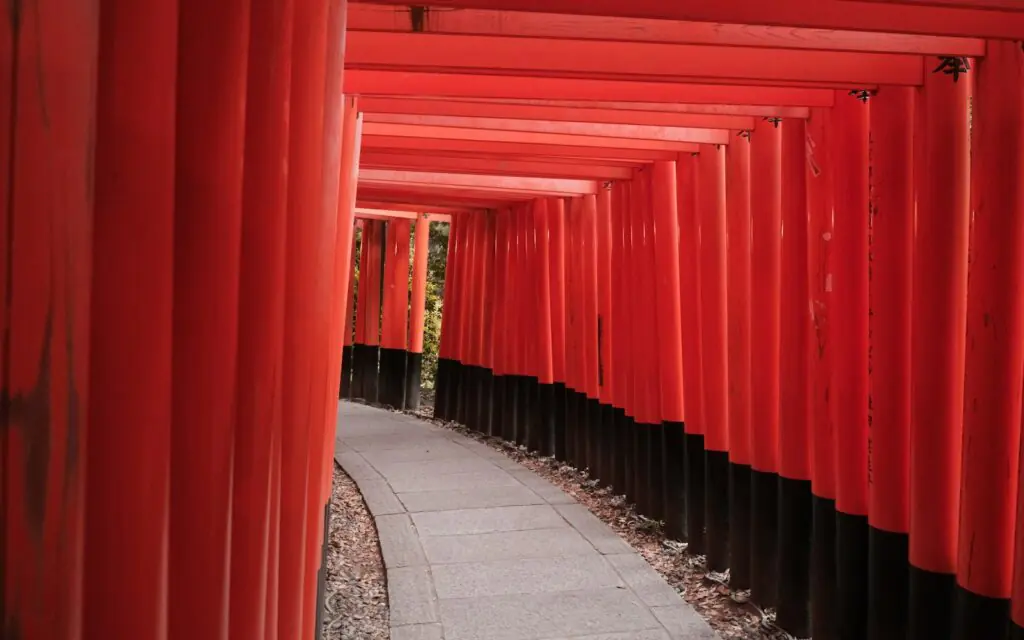 Corridor of red torii gates at Fushimi Inari shrine in Kyoto